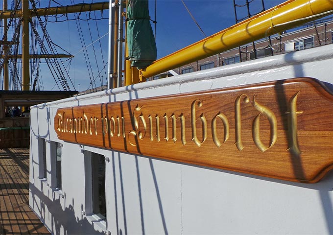 View of the upper deck of the "Alexander von Humboldt". The boat lettering shines in the sun.